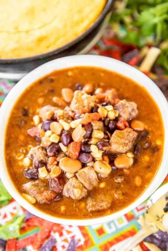 <p>Plain Chicken</p><p>Chuck roast, corn, black beans, pinto beans, taco seasoning, Rotel tomatoes, ranch seasoning, beef broth, and enchilada sauce. Brown the meat, dump everything in the Crockpot, and cook. That's the recipe. </p><p><strong>Get the recipe: <a href="https://www.plainchicken.com/slow-cooker-steak-enchilada-soup/" rel="nofollow noopener" target="_blank" data-ylk="slk:Slow Cooker Steak Enchilada Soup;elm:context_link;itc:0;sec:content-canvas" class="link ">Slow Cooker Steak Enchilada Soup</a></strong></p><p><strong>Related: <a href="https://parade.com/1316849/kristamarshall/black-bean-recipes/" rel="nofollow noopener" target="_blank" data-ylk="slk:60 Best Black Bean Recipes;elm:context_link;itc:0;sec:content-canvas" class="link ">60 Best Black Bean Recipes</a></strong></p>