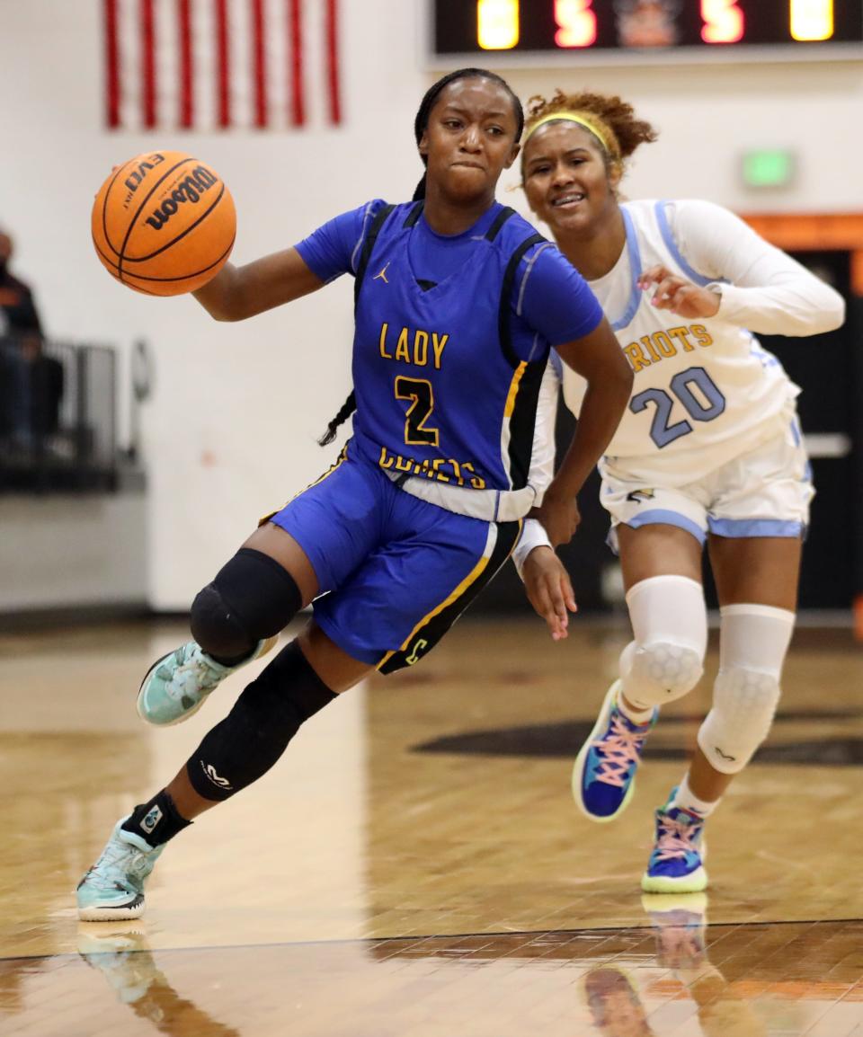 CSAS's Jordan Harrison drives past Putnam City West's Shamar Bert during the finals of the Putnam City Invitational on Jan. 8.