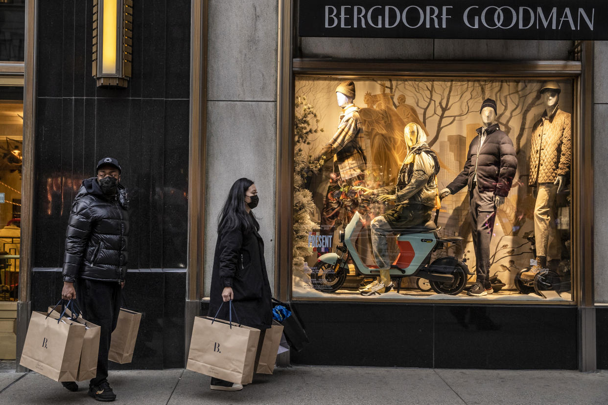 Shoppers walk past a Bergdorf Goodman store on Fifth Avenue in New York on Dec. 27, 2021. (Victor J. Blue / Bloomberg via Getty Images file)