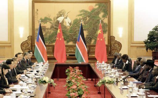 South Sudan President Salva Kiir (2nd R) speaks to Chinese President Hu Jintao (2nd L) during their meeting at the Great Hall of the People in Beijing. South Sudan's leader accused Sudan of declaring war on Tuesday as Khartoum's warplanes bombed border regions in defiance of international calls for restraint