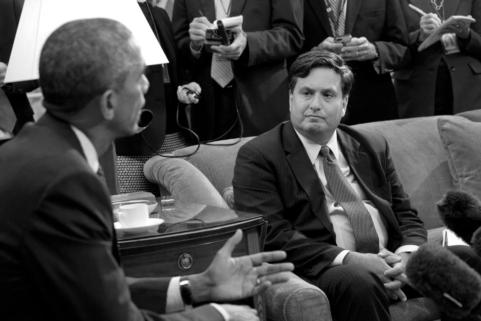 Reporters take notes as Ebola coordinator Ron Klain listens to President Barack Obama speak to the media about the government’s Ebola response in the Oval Office of the White House in Washington in October 2014. (Jacquelyn Martin/AP)