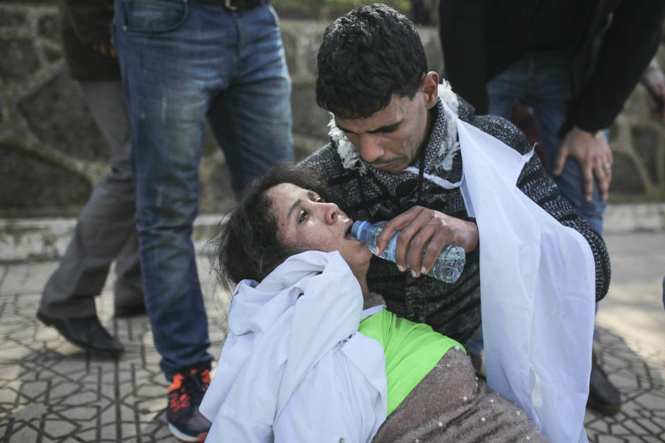 An injured protesting teacher is tended to by colleagues after clashes with security forces, during a demonstration in Rabat, Morocco, Wednesday, Feb. 20, 2019. Moroccan police fired water cannons at protesting teachers who were marching toward a royal palace and beat people with truncheons amid demonstrations around the capital Wednesday. (AP Photo/Mosa'ab Elshamy)