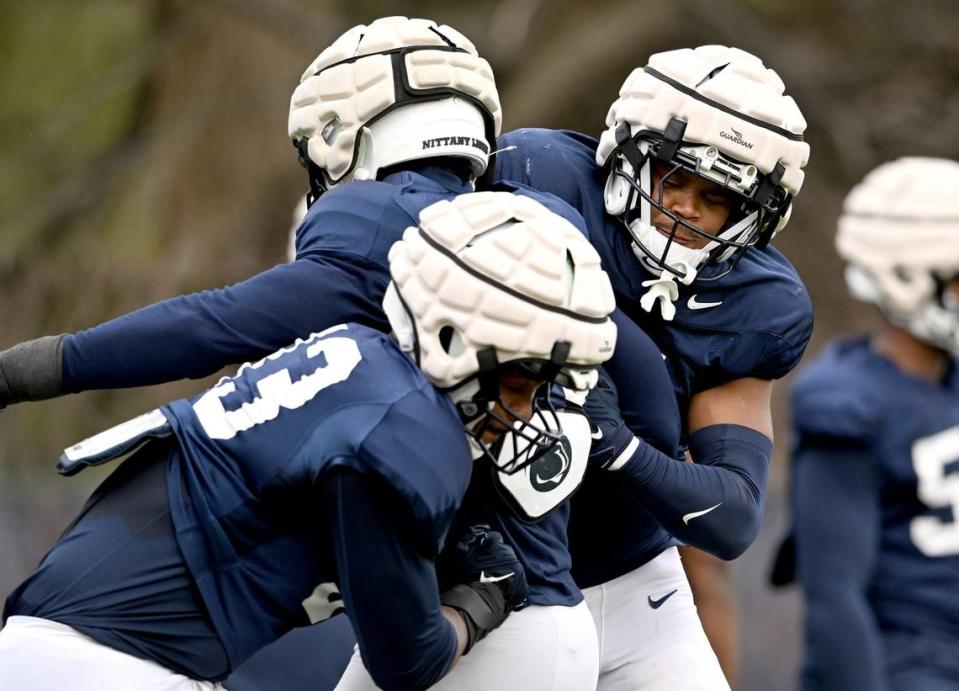 Penn State defensive end Abdul Carter tries to knock the ball away from a teammate during a drill at spring practice on Tuesday, March 26, 2024.