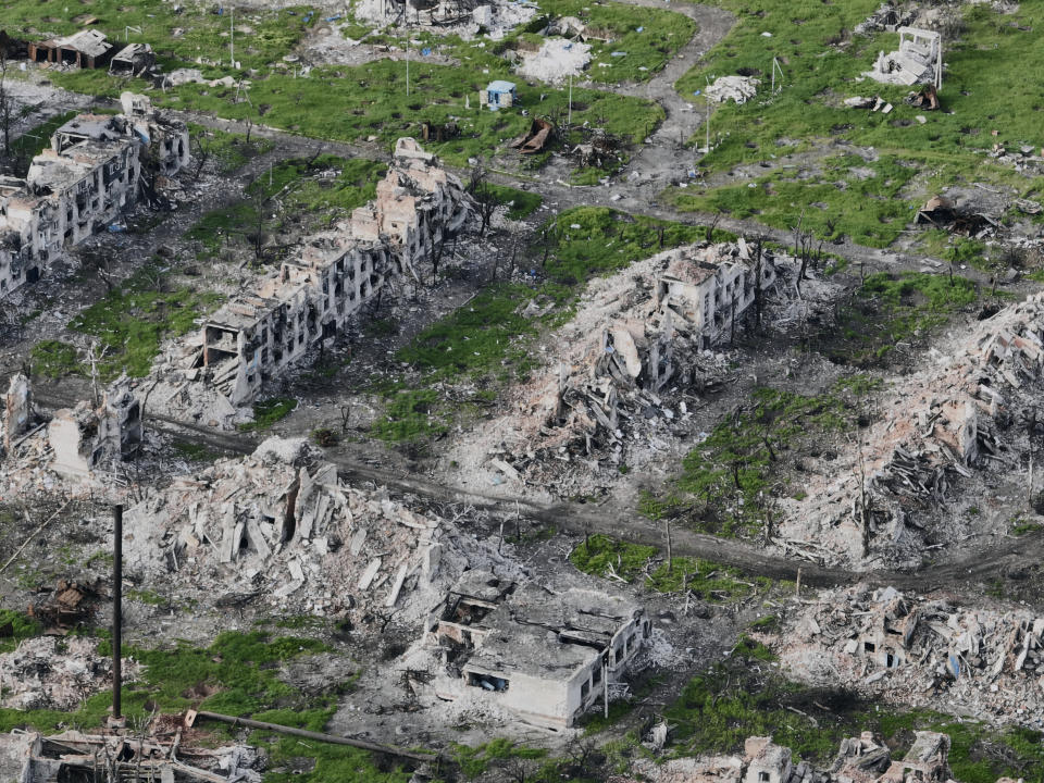 Residential buildings razed to the ground and shell craters are seen on an aerial view of Maryinka, an eastern city where heaviest battles with the Russian troops have been taking place in the Donetsk region, Ukraine, Thursday, May 11, 2023. (AP Photo/Libkos)