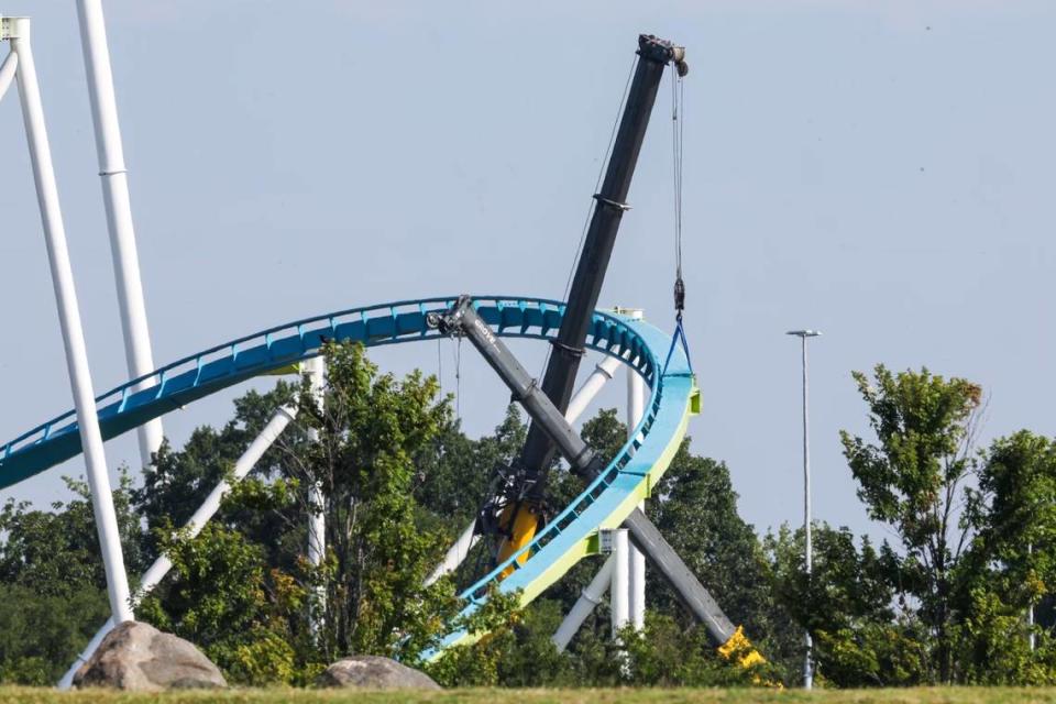 Cranes hold up the Fury 325 roller coaster track on Thursday, July 13, 2023. Carowinds is awaiting a new support column to replace a cracked one that was spotted on June 30.
