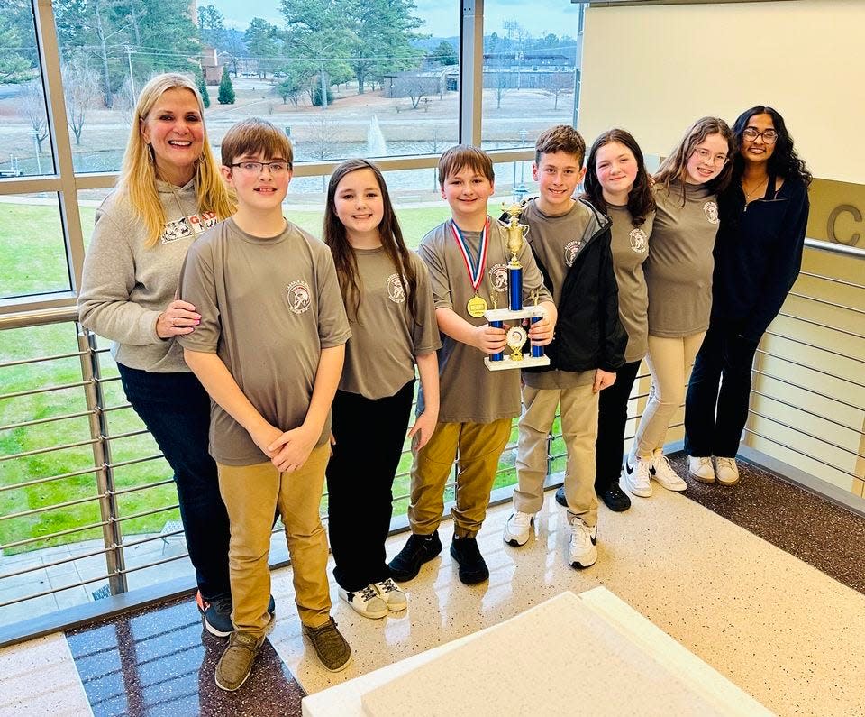 Gadsden Middle School's sixth-grade Scholars Bowl team was runner-up in the Alabama elementary division state championship held last month at Wallace State Community College in Hanceville. From left are sponsor Dr. Sue Bliss,Bronner Skaggs, Kate Harris, Noah Sherrouse, Michael Yother, .Iris McEleney, Wattsie Alexander and Latika Prasadh (captain of the eighth-grade team).