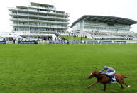 Serpentine ridden by jockey Emmet McNamara wins the Investec Derby at Epsom Racecourse, in Epsom, England, Saturday, July 4, 2020. (Edward Whitaker/PA via AP)