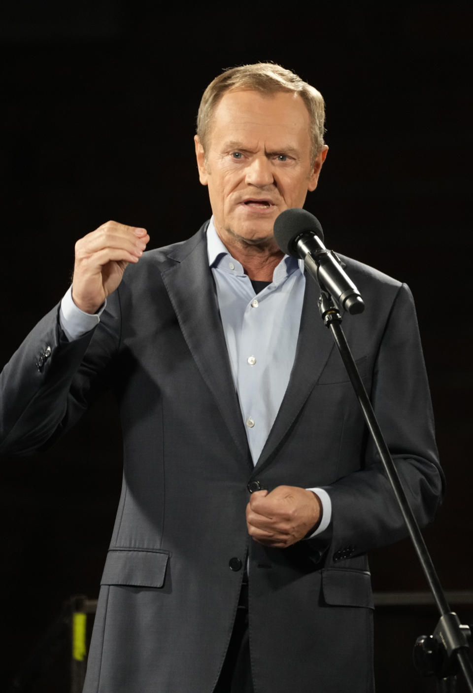 Former Polish Prime Minister Donald Tusk speaks from the podium during a demonstration in support of Poland's EU membership in Warsaw, Poland, Sunday, October 10, 2021. Poland's constitutional court ruled Thursday that Polish laws have supremacy over those of the European Union in areas where they clash, a decision likely to embolden the country's right-wing government and worsen its already troubled relationship with the EU. (AP Photo/Czarek Sokolowski)