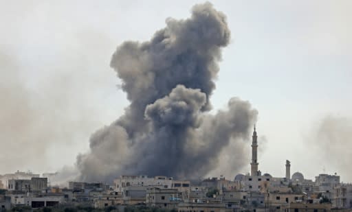 Smoke billows from the Syrian village of al-Nayrab in the northwestern Idlib province during bombardment by Syrian government forces and its allies