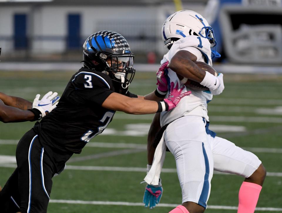 Decatur's Gavin Solito (3) pushes North Caroline's Zymear Smith (1) out of bounds Friday, Oct. 13, 2023, in Berlin, Maryland.