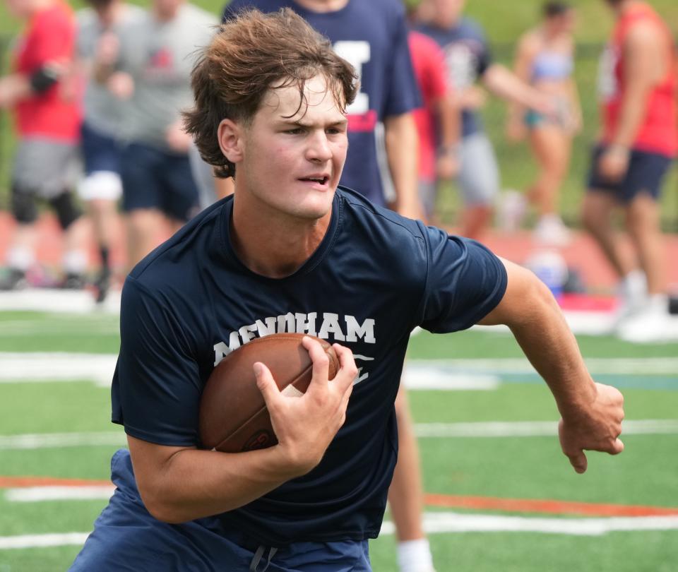 Mendham, NJ July 13, 2023 --  Thomas Suchonek, right. of Mendham practices for the upcoming season during his team’s summer football practice at Mendham HS.