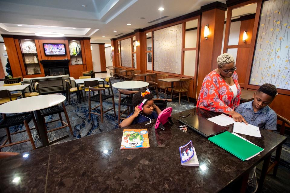 Remote learning has been a special challenge for LaMonica Cochran-Ray and her children, Jeremiah, 9, and Ziah, 3. The family has been on the move a lot, sometimes forced to take classes in the lobby of the hotel where they stayed.