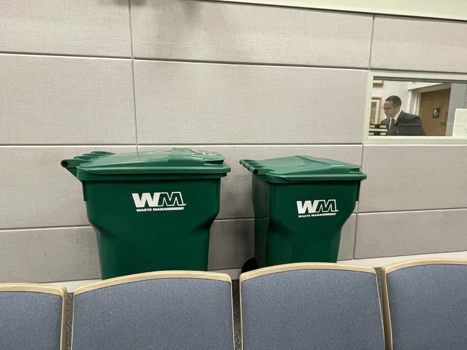 Two garbage carts provided by Waste Management at a June 21, 2022 meeting of the Jupiter Town Council show the difference between the 94-gallon cart (left) and the 64-gallon cart.