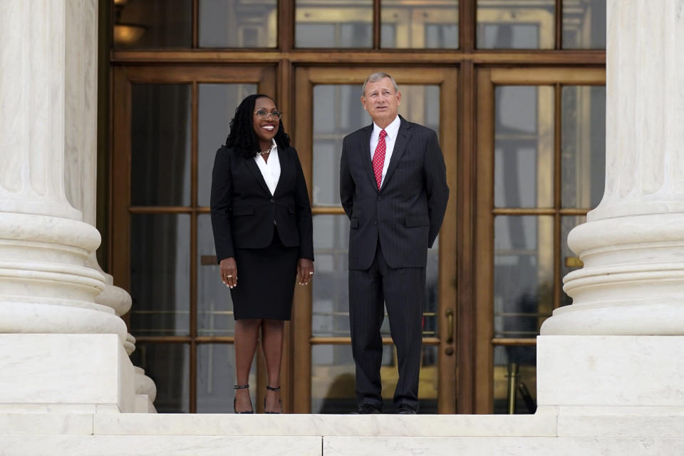 FILE - Supreme Court Associate Justice Ketanji Brown Jackson stands outside the Supreme Court with Chief Justice of the United States John Roberts, following her formal investiture ceremony at the Supreme Court in Washington, Friday, Sept. 30, 2022. (AP Photo/Carolyn Kaster, File)