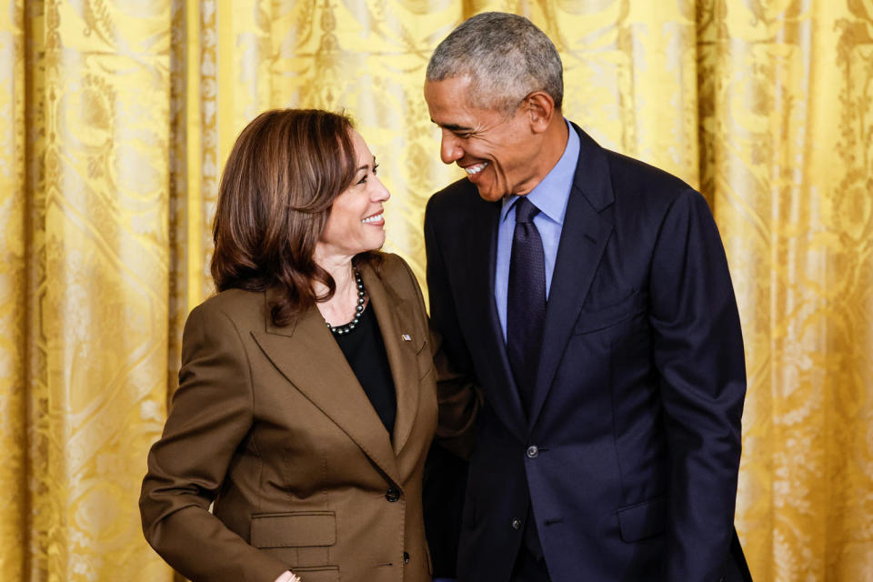 From left, Kamala Harris and Barack Obama smile at each other as they stand side by side (Chip Somodevilla file/Getty Images)