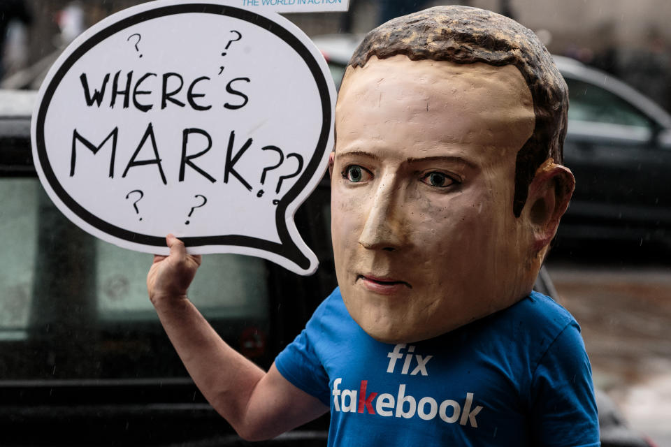 A protester wearing a model head of Facebook CEO Mark Zuckerberg poses for media outside Portcullis House on November 27, 2018 in London, England. Photo: Jack Taylor/Getty Images