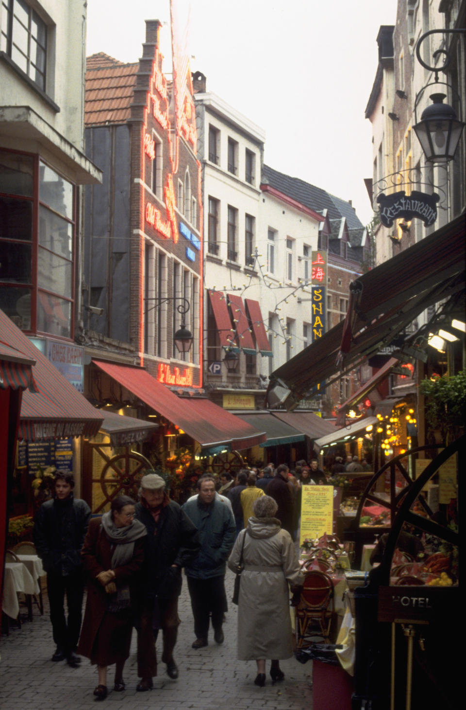 A busy street with people and shops