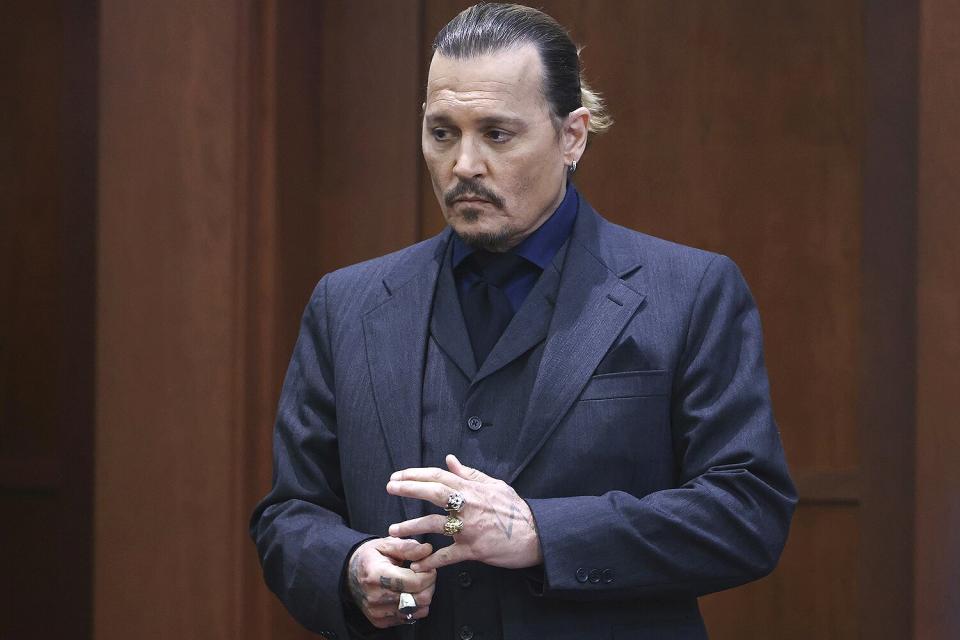 Actor Johnny Depp stands in the courtroom at the Fairfax County Circuit Court in Fairfax, Va., . Actor Johnny Depp sued his ex-wife Amber Heard for libel in Fairfax County Circuit Court after she wrote an op-ed piece in The Washington Post in 2018 referring to herself as a "public figure representing domestic abuse