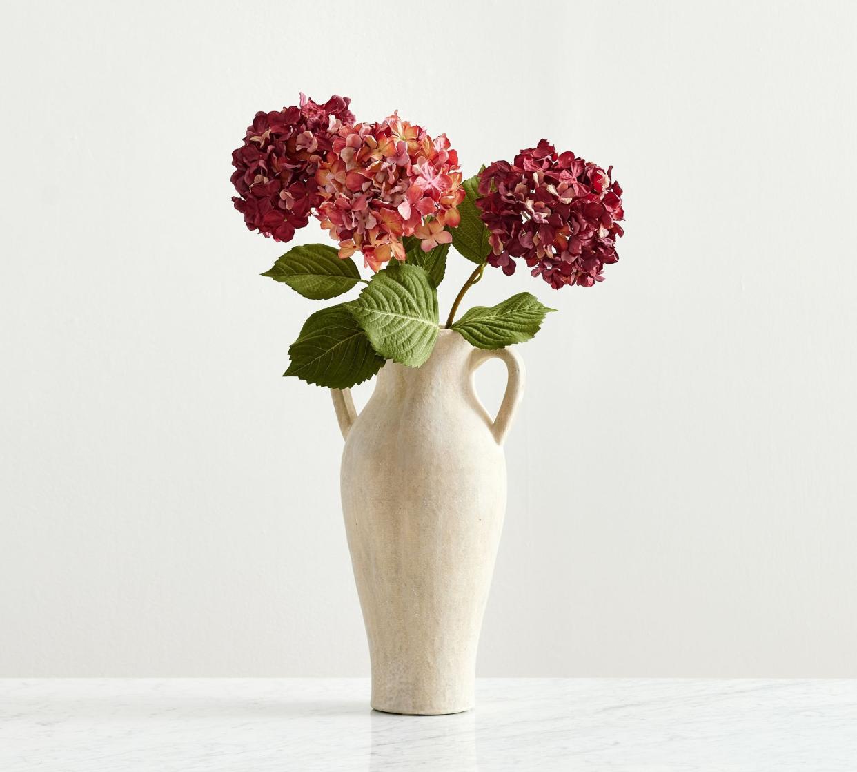 <p><a href="https://go.redirectingat.com?id=74968X1596630&url=https%3A%2F%2Fwww.potterybarn.com%2Fproducts%2Ffaux-hydrangea-bundle-burgundy%2F&sref=https%3A%2F%2Fwww.elledecor.com%2Fshopping%2Fhome-accessories%2Fg28423167%2Fbest-artificial-flowers%2F" rel="nofollow noopener" target="_blank" data-ylk="slk:Shop Now;elm:context_link;itc:0;sec:content-canvas" class="link rapid-noclick-resp">Shop Now</a></p><p>Faux Hydrangea Bundle</p><p>$50.00</p>