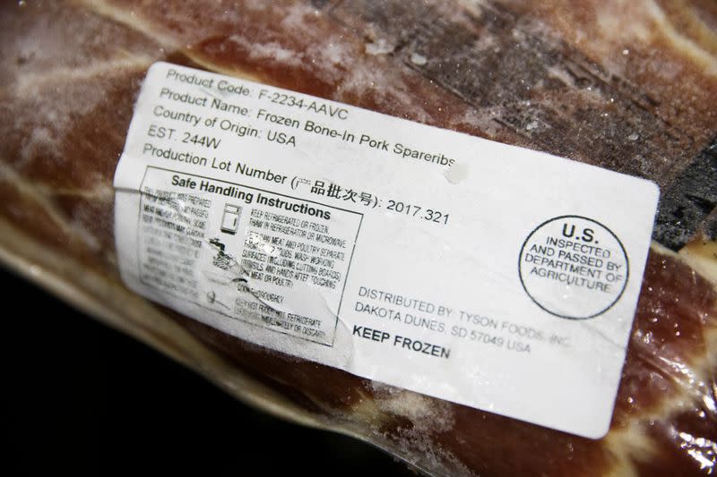 FILE PHOTO: A label shows the origin of frozen pork that was imported from the U.S. at the Beijing barbeque restaurant Home Plate that specializes in U.S. meat