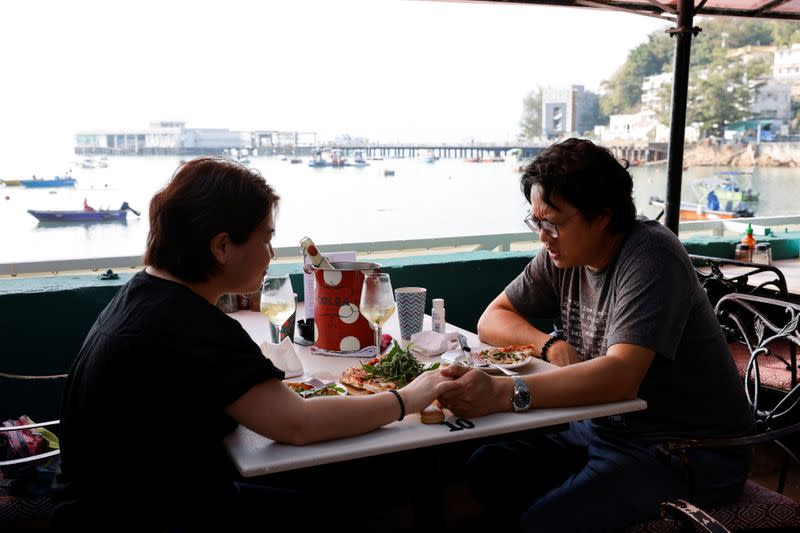 The Wider Image: Leaving Hong Kong: A family makes a wrenching decision