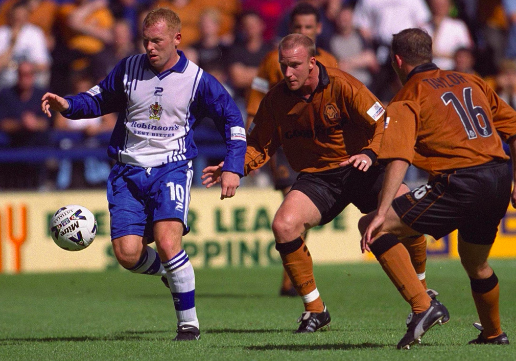 Layton Maxwell (left), pictured playing for Stockport County against Wolves in August 2000, quit the professional game for a life of crime. (Reuters)