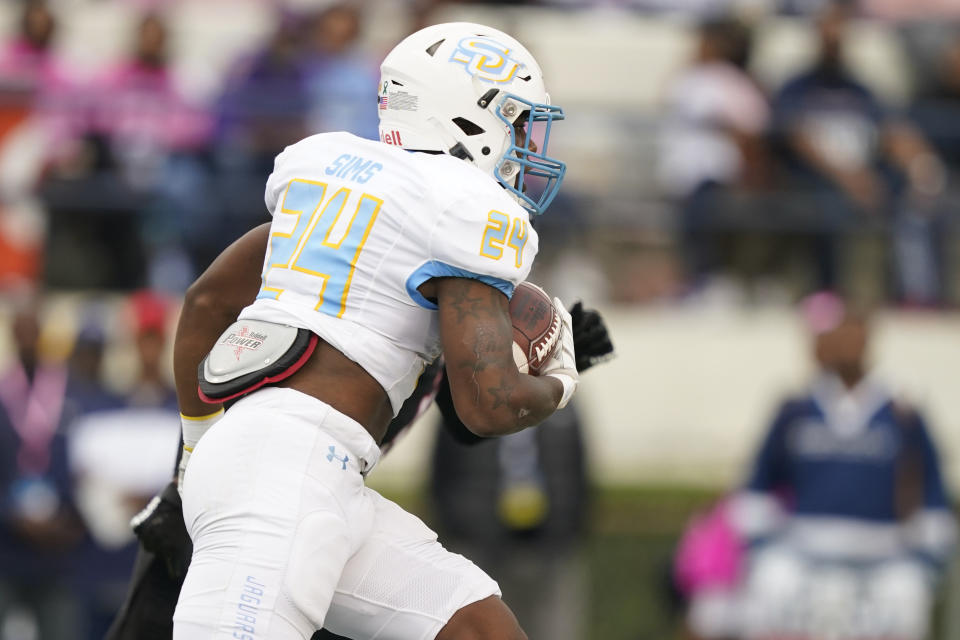 Southern University running back Jerodd Sims (24) runs for a first down against Jackson State during the first half of an NCAA college football game in Jackson, Miss., Saturday, Oct. 29, 2022. (AP Photo/Rogelio V. Solis)