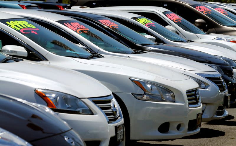 FILE PHOTO: FILE PHOTO: Automobiles are shown for sale at a car dealership in Carlsbad, California