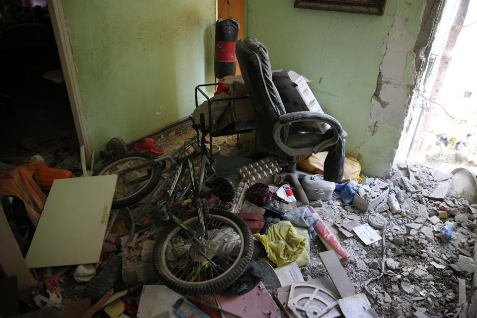 The interior apartment building sits destroyed after being hit by a rocket fired by Palestinian militants from Gaza, in the southern Israeli city of Ashkelon, Israel, Tuesday, Nov. 13, 2018. Gaza militants fired dozens of rockets at southern Israel early on Tuesday, killing a man in a strike on a residential building, and warning they would escalate their attacks if Israel continues bombing targets in the Gaza Strip. (AP Photo/Ariel Schalit)