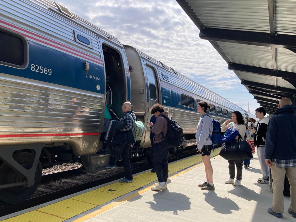 Passengers board a southbound Amtrak train in Middlebury on April 28, 2024.