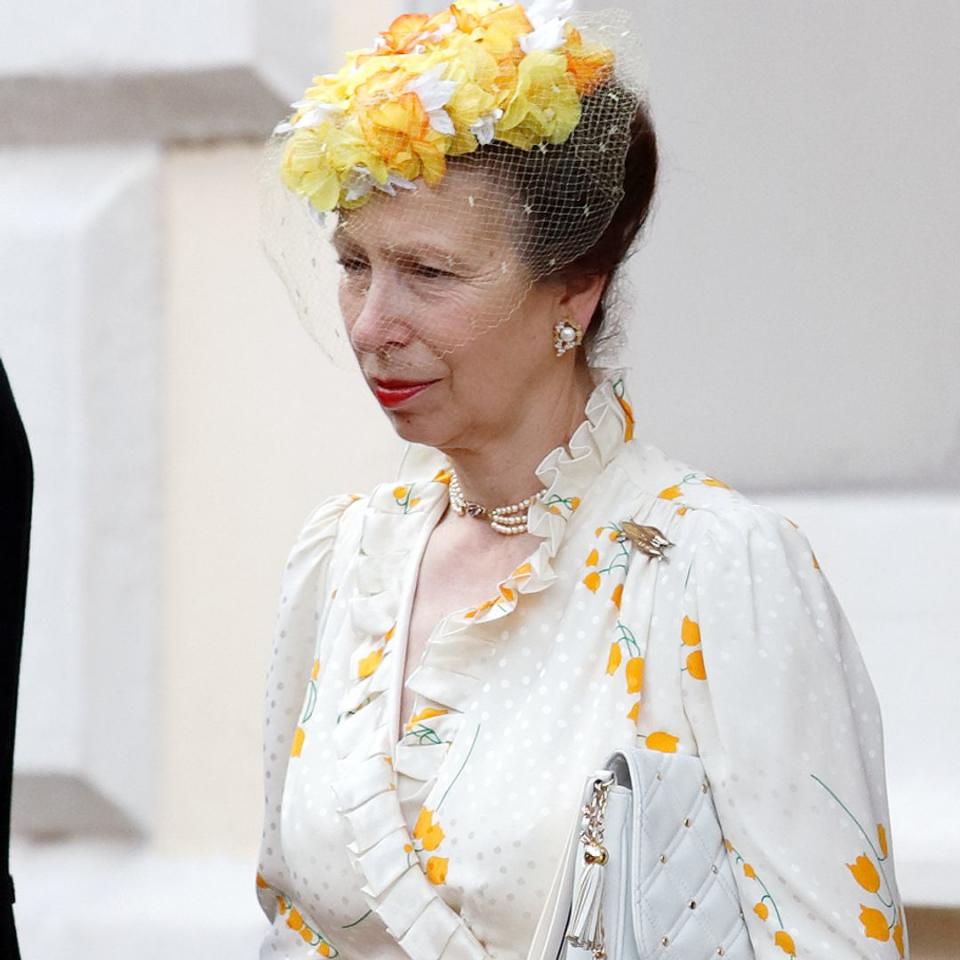 Princess Anne goes bold in white wedding guest dress and sultry red lip in rare photos with husband Timothy