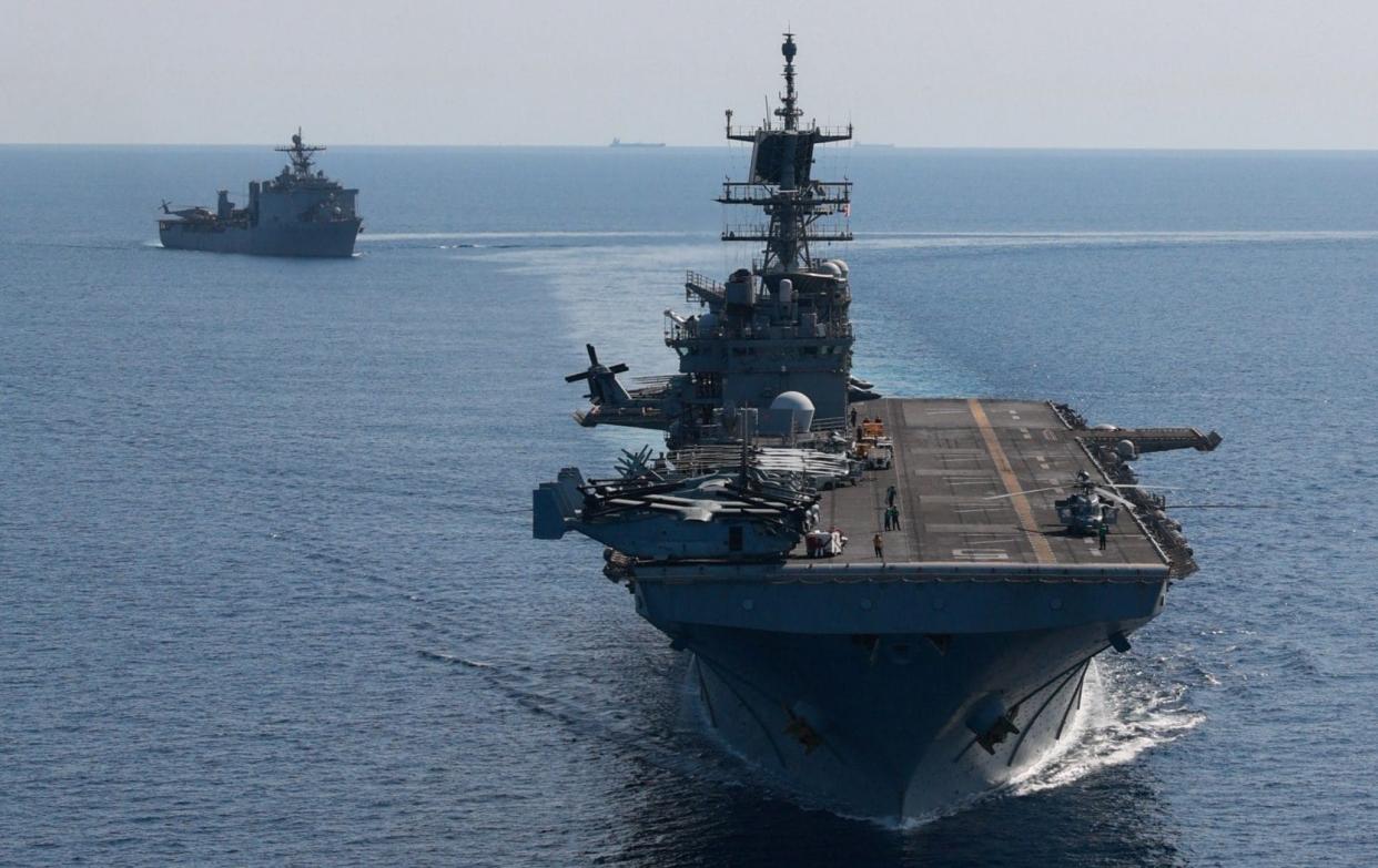 American 'big deck' amphibious assault ship USS Bataan and dock landing ship USS Carter Hall with elements of the 26th Marine Expeditionary Unit embarked, seen in the Red Sea, 2023