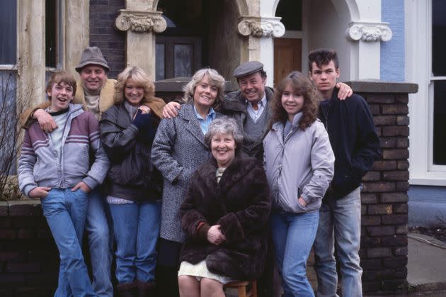 Original EastEnders cast members, including Gillian Taylforth and Bill Treacher, pose on the show's set (Photo: Radio Times via Getty Images)