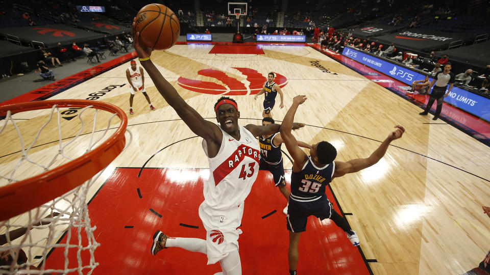 TAMPA, FL- MARCH 24: Pascal Siakam #43 of the Toronto Raptors drives to the basket during the game against the Denver Nuggets on March 24, 2021 at Amalie Arena in Tampa, Florida. NOTE TO USER: User expressly acknowledges and agrees that, by downloading and or using this Photograph, user is consenting to the terms and conditions of the Getty Images License Agreement. Mandatory Copyright Notice: Copyright 2021 NBAE (Photo by Scott Audette/NBAE via Getty Images)