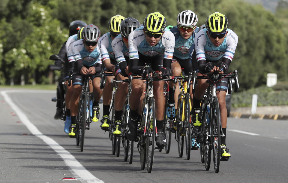 Members of the Esteban Chaves Foundation cycling team train in Puente Piedra near Bogota, Colombia, Friday, Sept. 13, 2019. Although the foundation team's cyclists take mandatory doping tests, Colombia has 42 cyclists currently sanctioned or provisionally suspended. Only Costa Rica has more cyclists suspended by the sport's world governing body than Colombia. (AP Photo/Fernando Vergara)