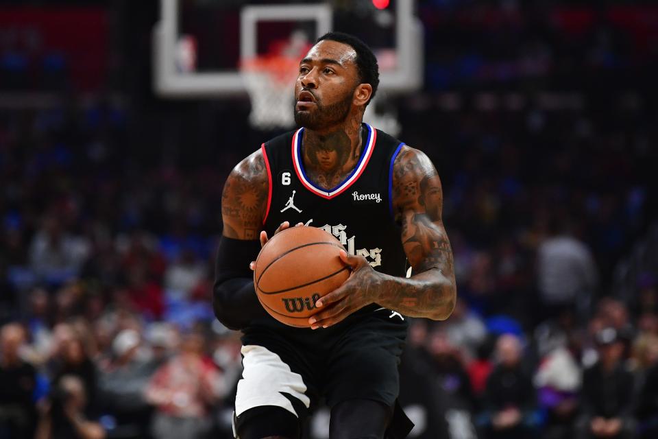 Dec 15, 2022; Los Angeles, California, USA; Los Angeles Clippers guard John Wall (11) shoots against the Phoenix Suns during the first half at Crypto.com Arena. Mandatory Credit: Gary A. Vasquez-USA TODAY Sports