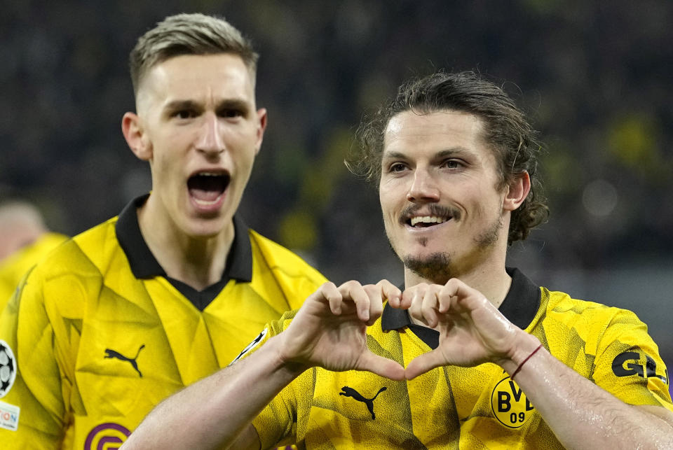 Dortmund's Marcel Sabitzer, right, celebrates his side's 4th goal during the Champions League quarterfinal second leg soccer match between Borussia Dortmund and Atletico Madrid at the Signal-Iduna Park in Dortmund, Germany, Tuesday, April 16, 2024(AP Photo/Martin Meissner)