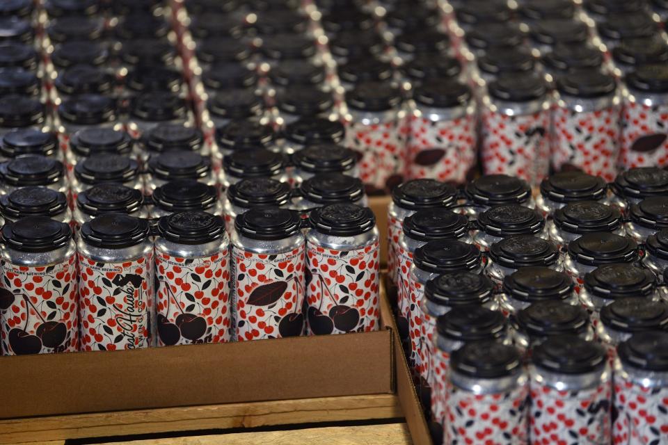 Cans of beer in cardboard trays are seen at Ghost Hawk in Clifton.