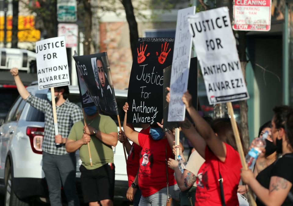 Protesters call for justice in the shooting death of Anthony Alvarez outside the headquarters of the Civilian Office of Police Accountability, Tuesday, April 27, 2021, in Chicago.