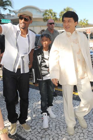 <p>Gustavo Caballero/Getty</p> Will Smith, Jaden Smith and Jackie Chan attend a May 2010 screening of 'The Karate Kid' in Miami.