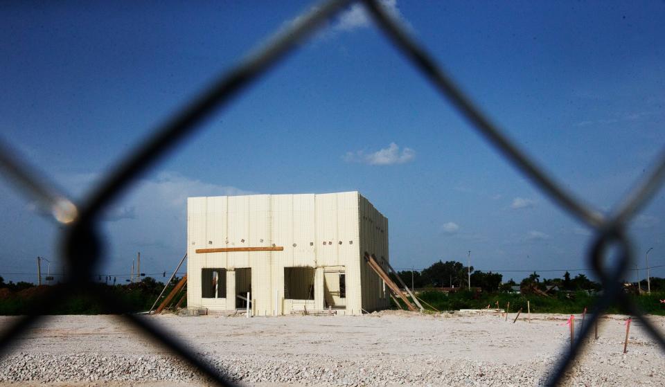 A makeshift structure stands on the property where the Towles Gardens apartment complex is supposed to be built. Work has stopped because of a dispute between the contractor and the developer.