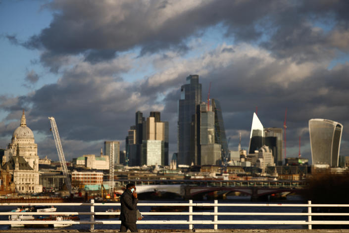 FTSE  A person walks across Waterloo Bridge with the City of London financial district in the background, in London, Britain, January 13, 2023. REUTERS/Henry Nicholls