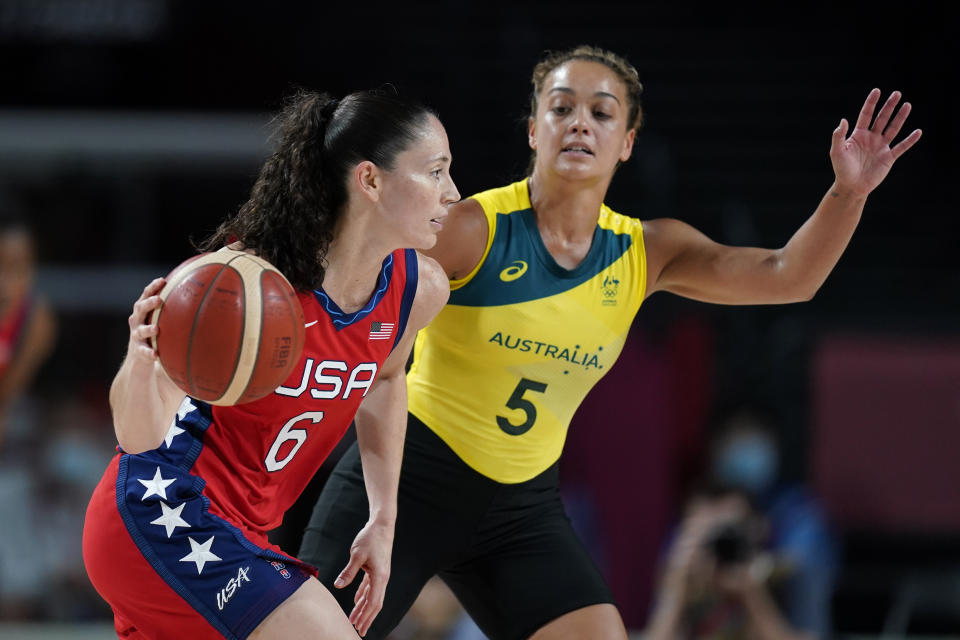 United States's Sue Bird (6) drives past Australia's Leilani Mitchell (5) during a women's basketball quarterfinal round game at the 2020 Summer Olympics, Wednesday, Aug. 4, 2021, in Saitama, Japan. (AP Photo/Charlie Neibergall)