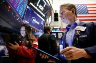 Traders work on the floor of the NYSE in New York