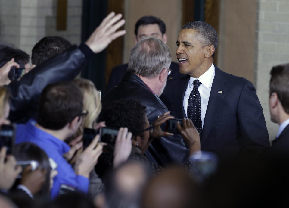 President Barack Obama arrives to speak at the Union Depot in St. Paul, Minn., Wednesday, Feb. 26, 2014, where he announced a new competition encouraging investments for job creation and infrastructure as part of his "Year of Action." (AP Photo/Jim Mone)