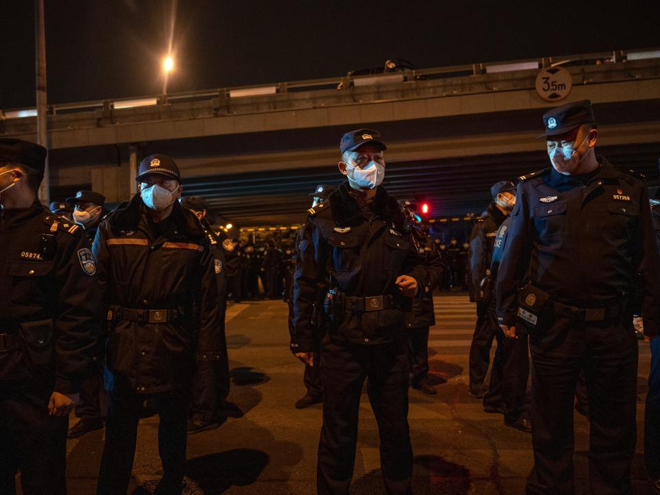 olice form a cordon during a protest against China's strict zero COVID measures on November 28, 2022 in Beijing, China.
