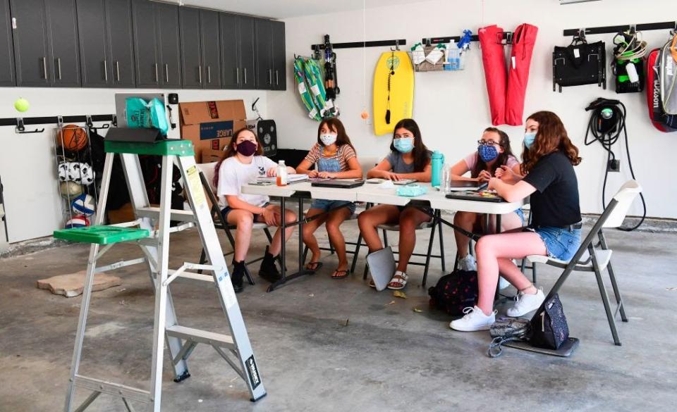 Aug. 27: Seventh graders in a learning pod follow an online class in a home garage in Calabasas, California. (Getty Images)