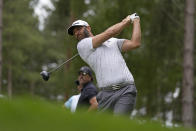 Dustin Johnson of the United States plays from the 4th tee during the first round of the inaugural LIV Golf Invitational at the Centurion Club in St. Albans, England, Thursday, June 9, 2022. (AP Photo/Alastair Grant)