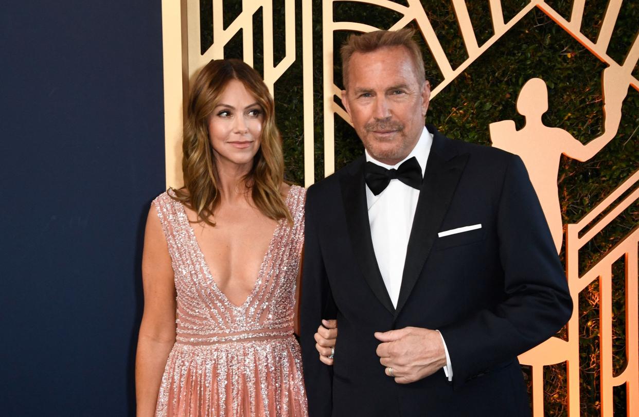 Kevin Costner and his wife Christine Baumgartner arrive for the 28th Annual Screen Actors Guild (SAG) Awards in 2022.