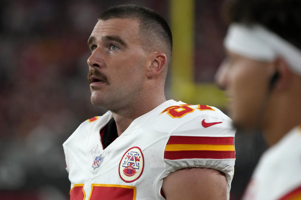 Kansas City Chiefs tight end Travis Kelce watches from the sidelines during the first half of an NFL preseason football game against the Arizona Cardinals, Saturday, Aug. 19, 2023, in Glendale, Ariz. (AP Photo/Rick Scuteri)